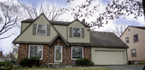 brick and green suburb house