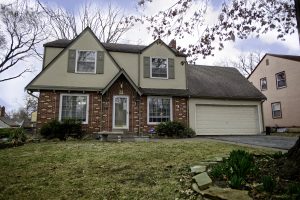 brick and green suburb house