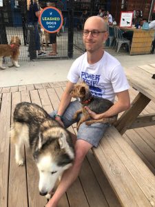 Man with husky at KC BarK